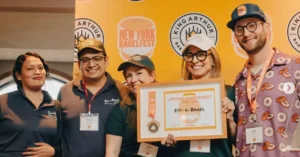Ess-A-Bagel Award ceremony with team celebrating Lifetime Achievement recognition at New York BagelFest.